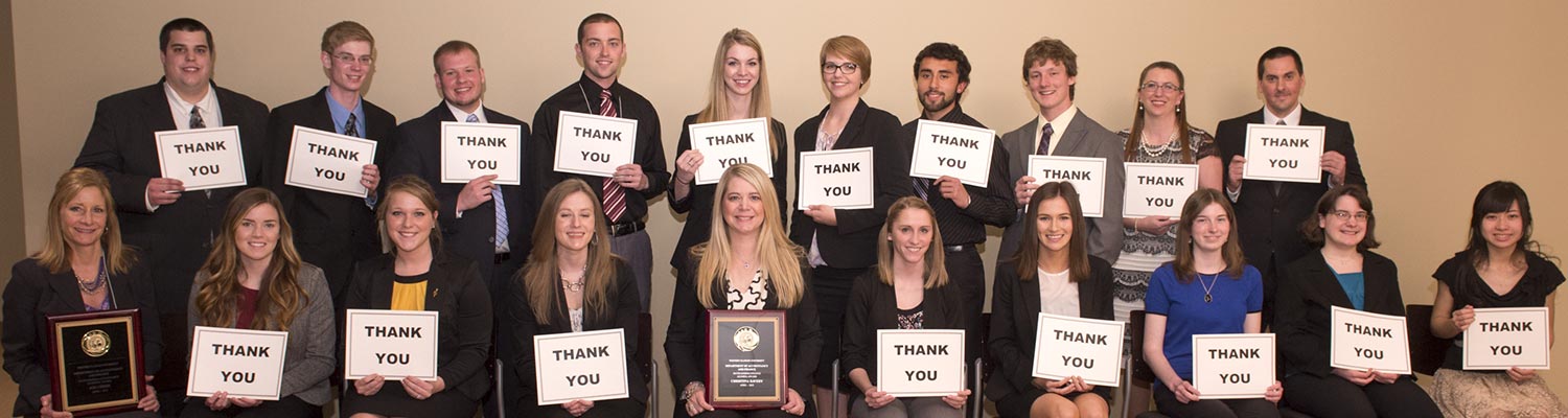 students holding thank you sign