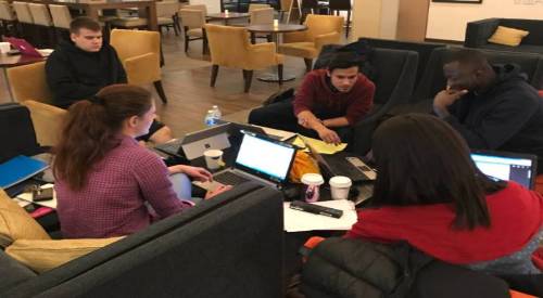 students working with a faculty member
