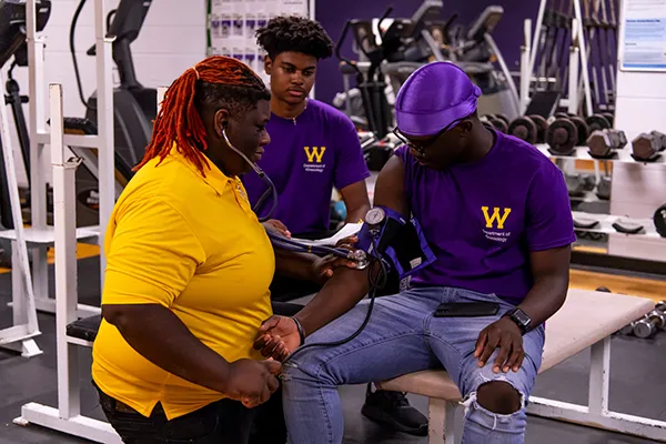 students testing blood pressure