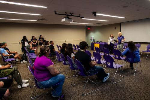 Interim University President Kristi Mindrup speaks with students at this year's camp. WIU Political Science Professor Julia Albarracín stands next to her providing translation. 