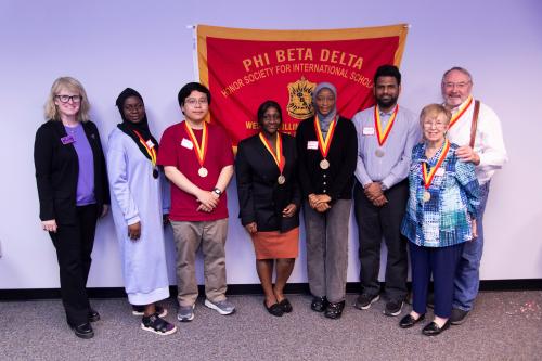 Pictured from left to right: WIU President Kristi Mindrup, Hawa Ibrahim, Minh Kha Tran, Enyonam Adjoa Neku, Animat Karem, Md Touhidan Nur Shimul, Marti Dallmeyer and Jim Dallmeyer. Charlene Callison was not able to attend.