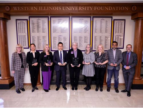 From left to right: WIU President Dr. Kristi Mindrup; Accounting Professor Lu Lu; CBT Professor Honey Zimmerman; Management Professor Tae Yang; Academic Advisor Lisa Melz-Jennings; English Professor Alisha White; HRM Professor Susan Stewart; CBT Professor Mohammad Shamsuddoha; and WIU Provost Dr. Mark Mossman.