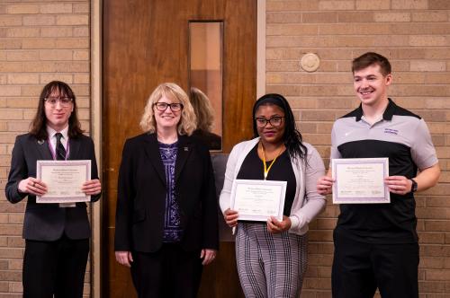 From left to right, WIU Political Science and History Senior, Winter Hurst-Leadicker, WIU President Kristi Mindrup, WIU Biology Senior Naomi Scotland, and WIU Electrical Engineering Senior Ryan Vance. 